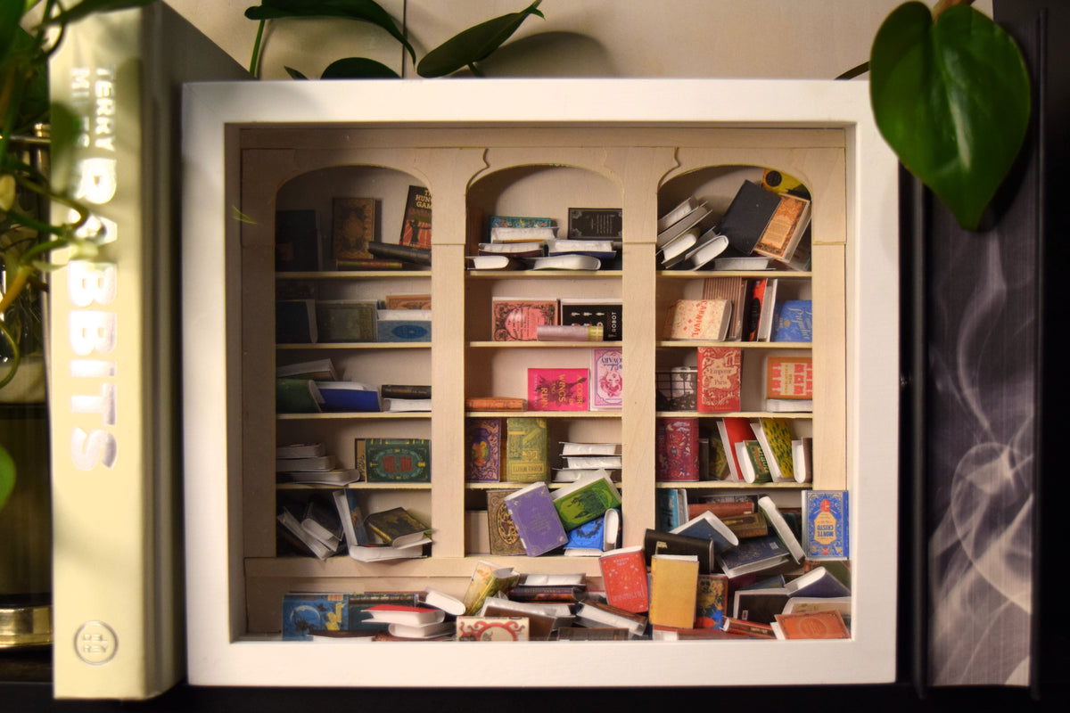 Original Shake-A-Shelf white anxiety bookshelf with miniature books